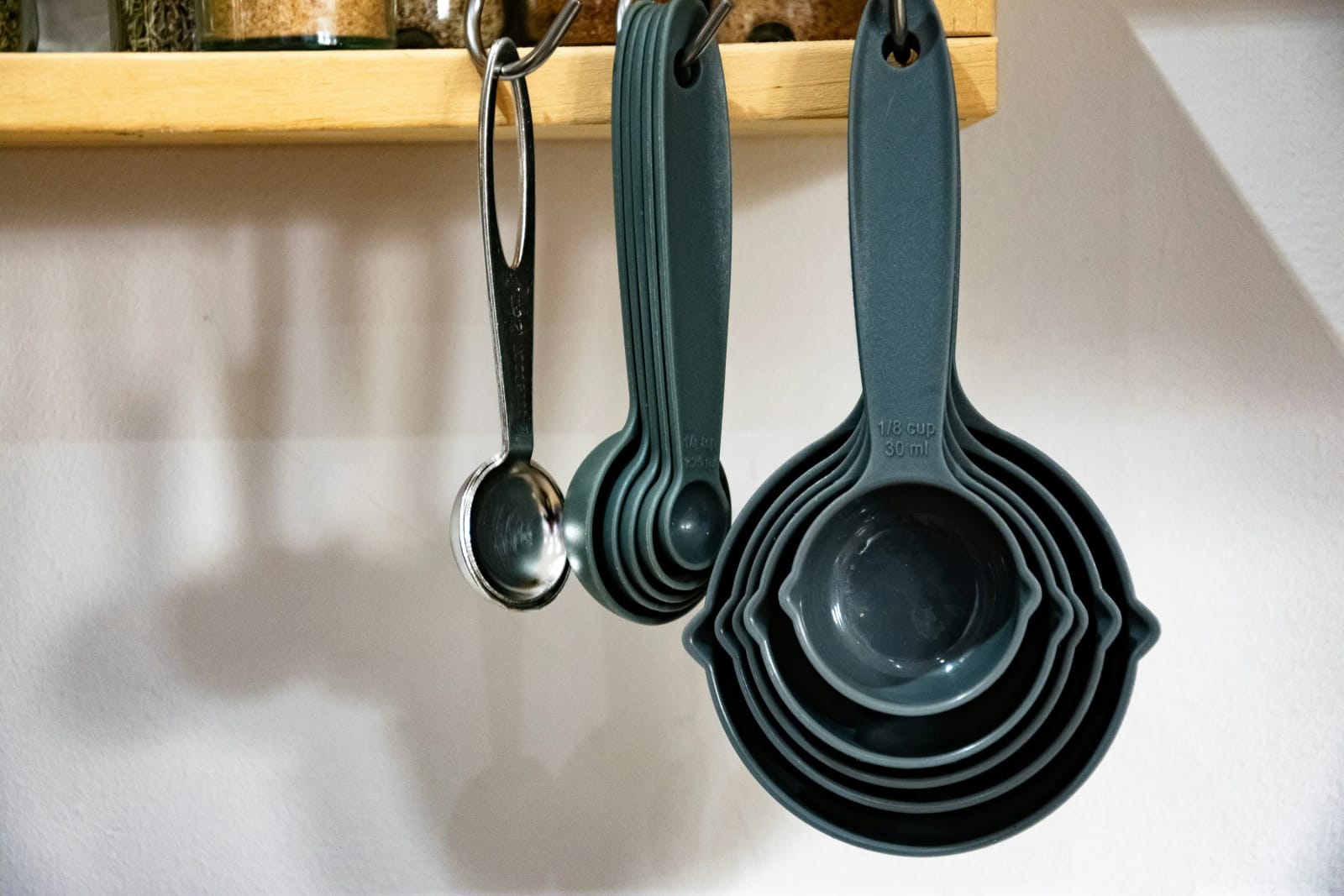 Copper measuring cups stamped 1 cup 250 mL and quarter cup 60 mL, the metric sizes used in Australia, New Zealand and Canada.